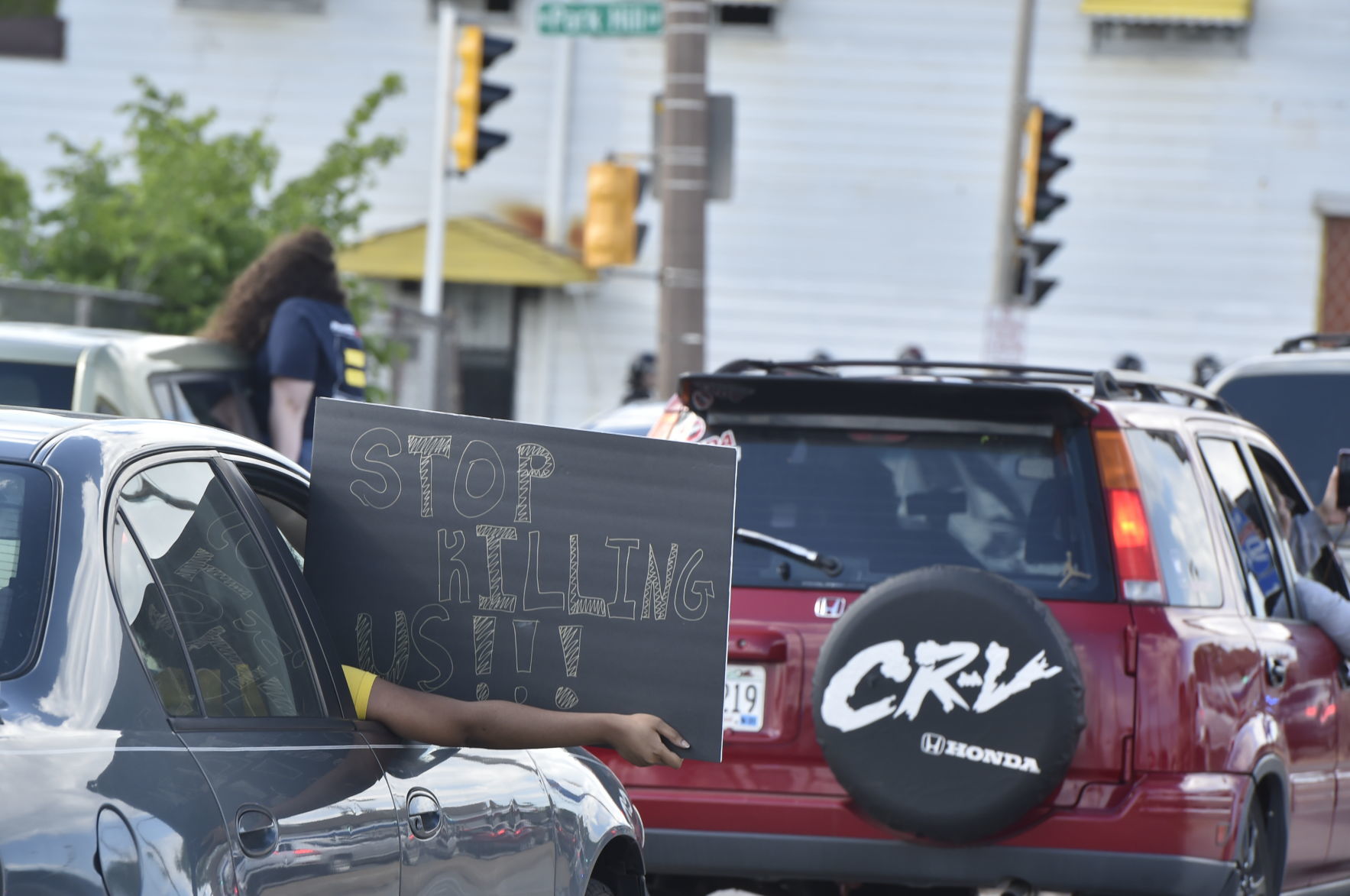 Stop killing us sign